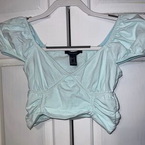 Blue cropped shirt with corset waist